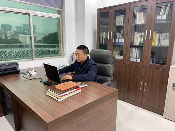 Mr. Wang is at work
